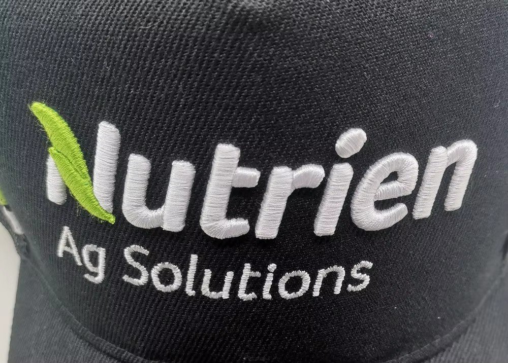 3D puff embroidery on a black cap: the Nutrien Ag Solutions logo raised above the fabric