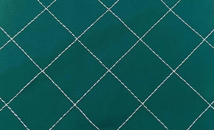 Green cap fabric decorated with white diamond lattice stitching