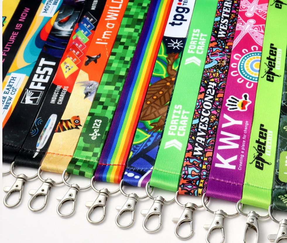 Gallery of custom printed lanyards with customer logos and full-colour patterns, each finished with a metal swivel snap hook