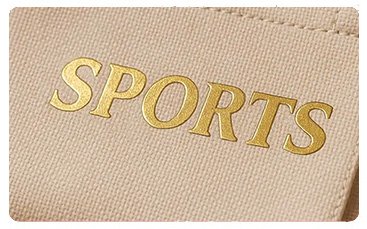 SPORTS logo stamped in gold foil on canvas